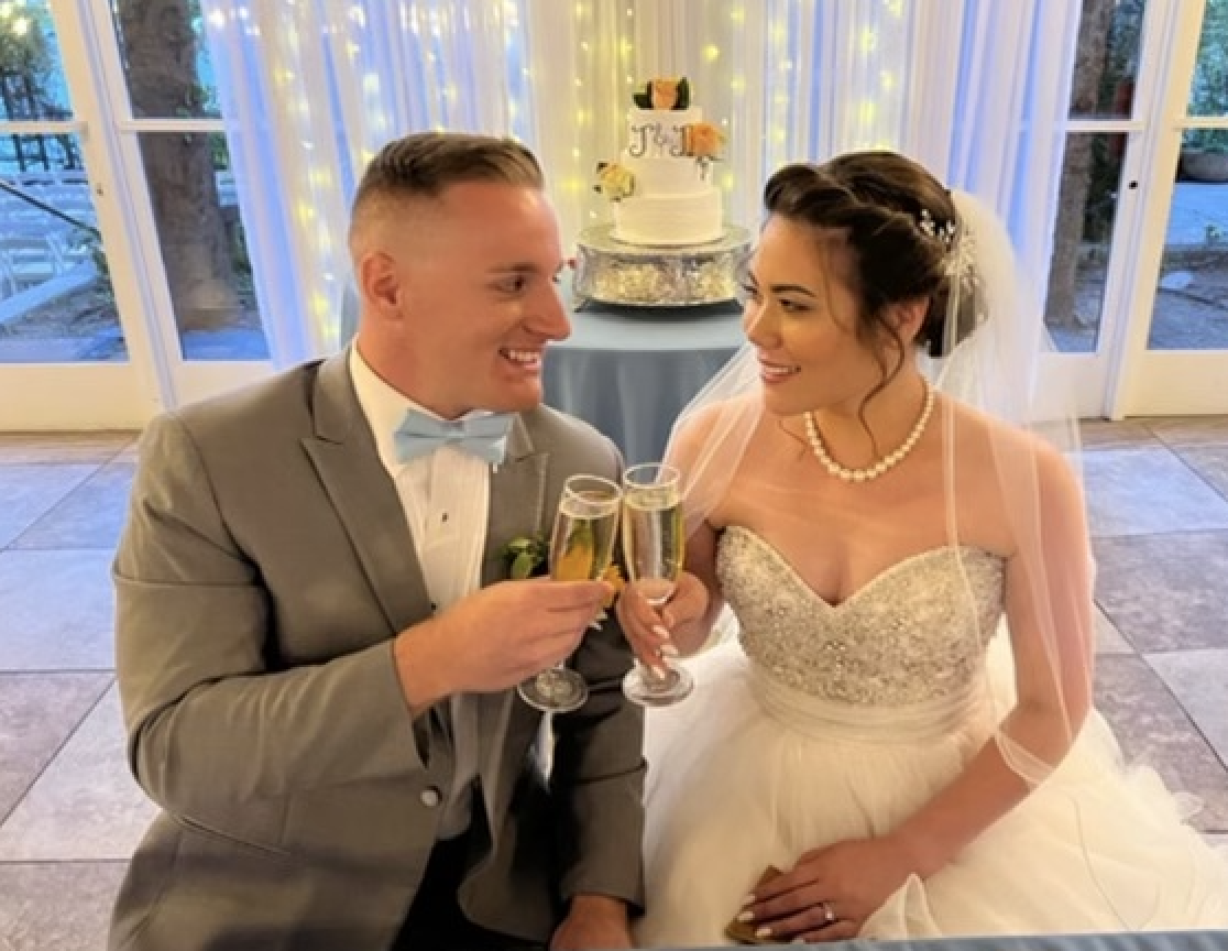 Bride and groom sharing a champagne toast